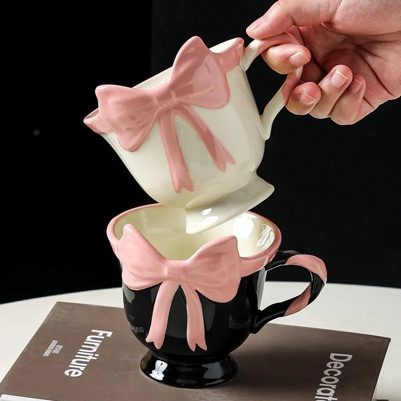 White ceramic mug with heart and bow design, 301-400ml capacity, bow-shaped handle