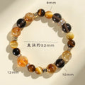 Close-up of a natural yellow artificial crystal bead bracelet with 10mm tower-shaped beads on a string.