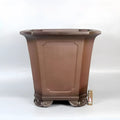 Ceramic antique redware flowerpot purple sand finish 40x40x40cm on a wooden table