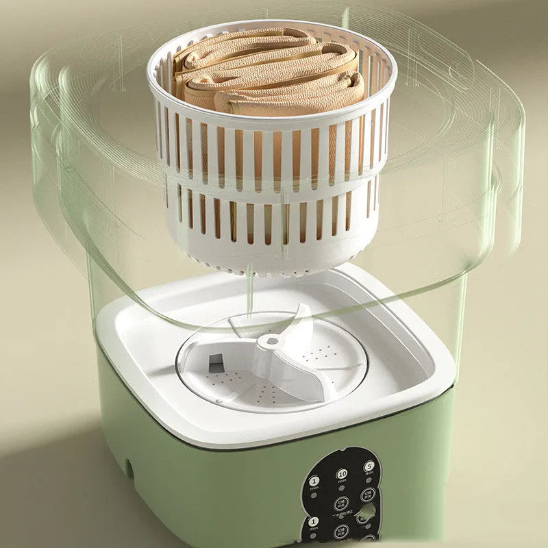 Green foldable portable mini washing machine for socks and underwear with drain pipe and basket.