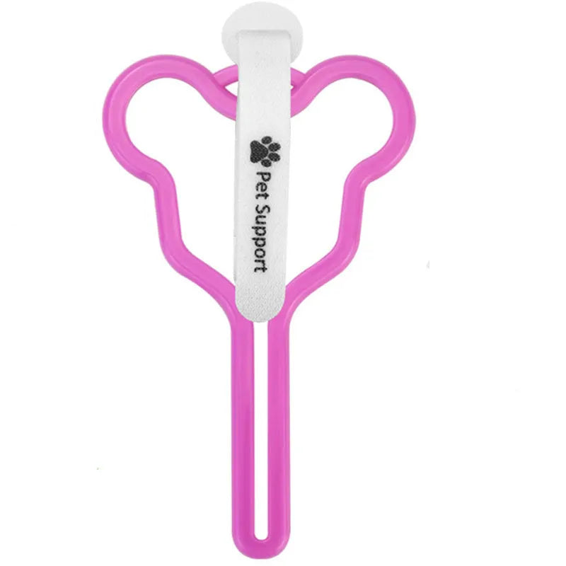 A hands-free dog poop bag holder with a fixed metal clip and a black Velcro strap for leash attachment.
