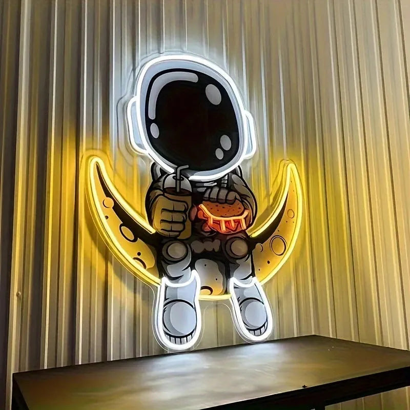 Wall mounted astronaut neon light with moon design measuring 30cm by 35cm