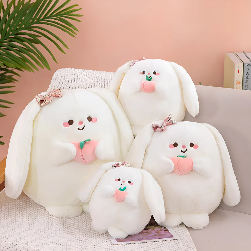 Rabbit peach plush toy in 20cm, 25cm, 35cm and 45cm heights on a plain background
