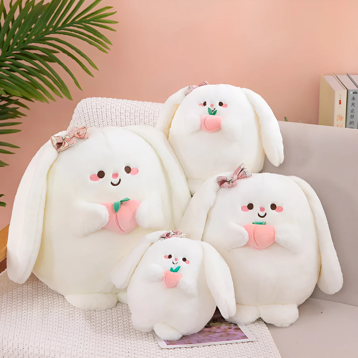 Rabbit peach plush toy in 20cm, 25cm, 35cm and 45cm heights on a plain background