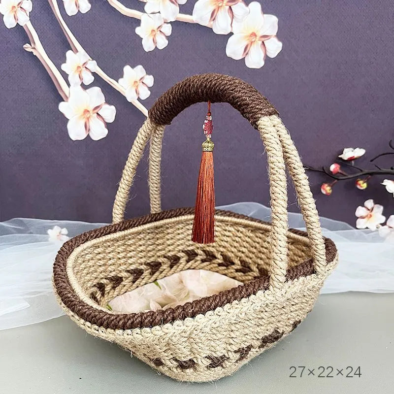 Small hand-woven straw storage basket in brown, measuring 19cm wide.