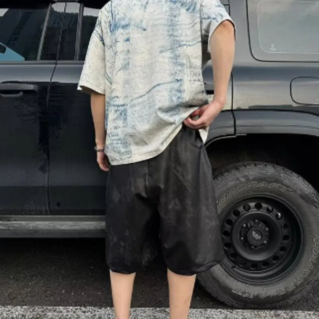 A man wearing a solid-colour, loose-fit, short-sleeve t-shirt in a Korean style.