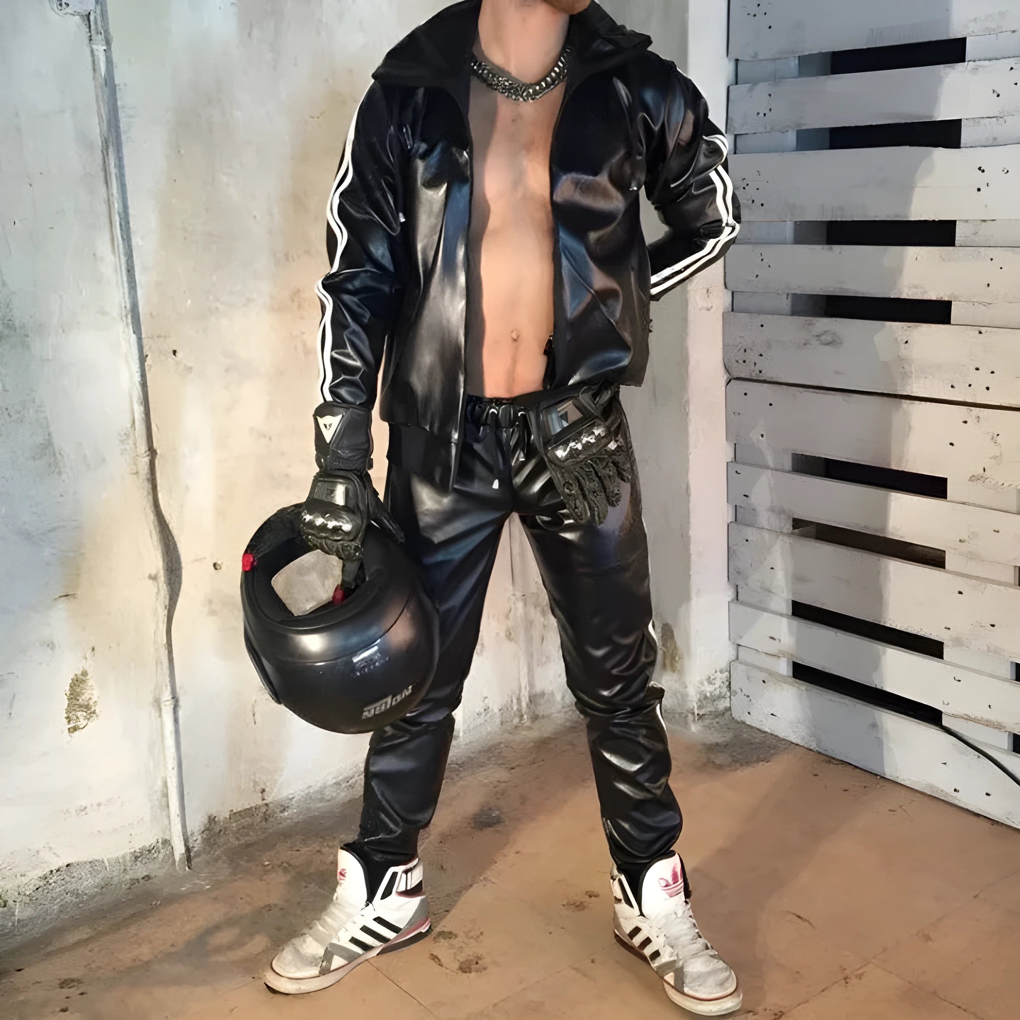 Black men's hooded sports tracksuit set with PU leather jacket and matching trousers.