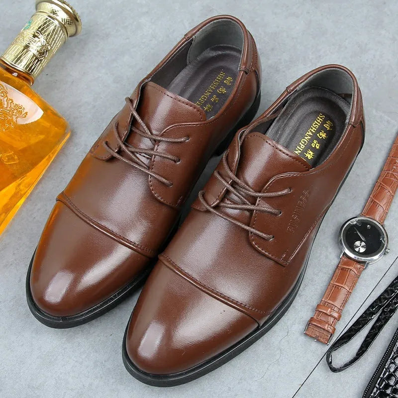 Men's black formal lace-up shoe with decorative stitching and a horse buckle on a rubber sole.