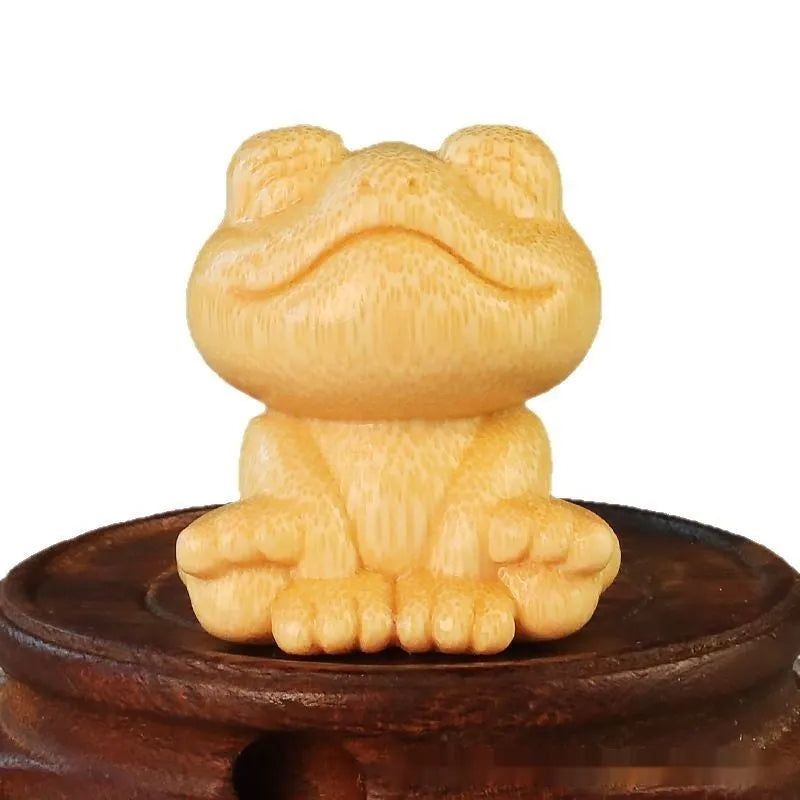 Smiling frog solid bamboo carving ornament with cartoon style measuring 5cm tall