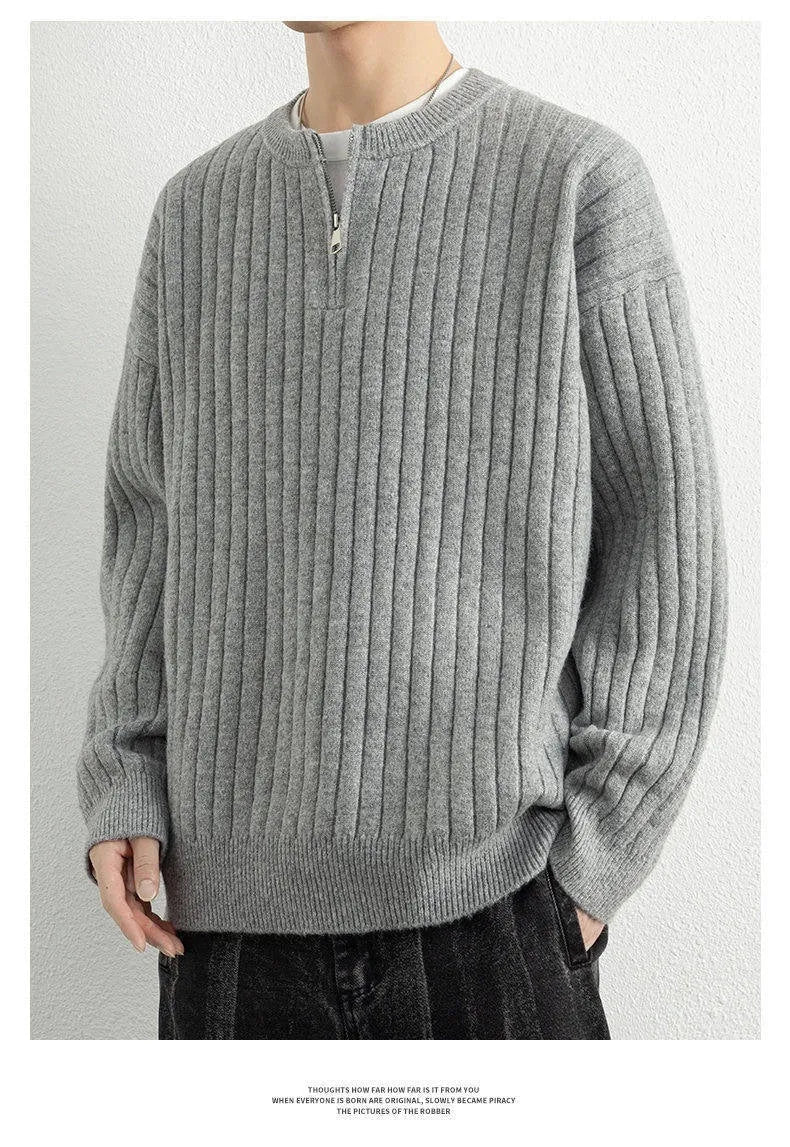 Men's grey half zip loose fit pullover sweater with textured knit on a hanger.