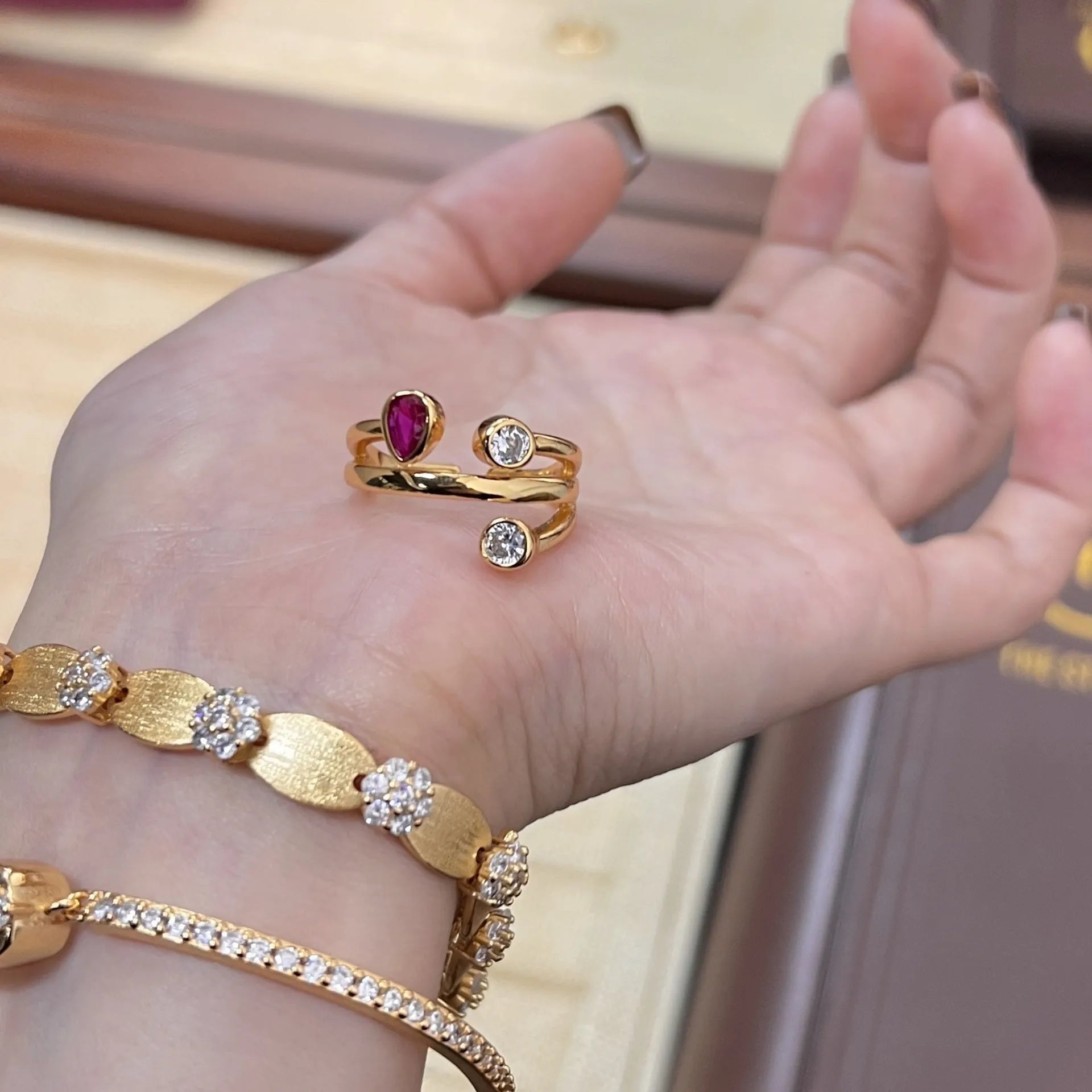 Double-headed copper ring with irregular cross shape and two-tone colour options.