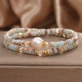 Natural colour Shoushan stone double circle bracelet with crystal one pearl on white background