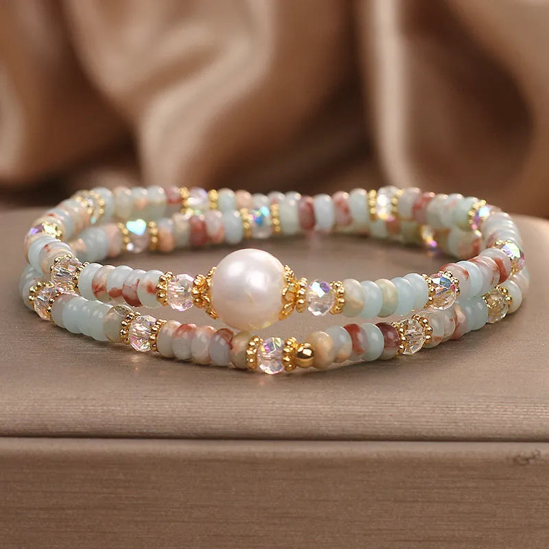 Natural colour Shoushan stone double circle bracelet with crystal one pearl on white background