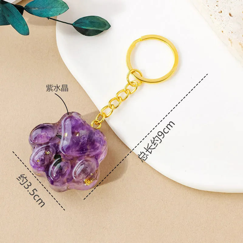 Natural crystal cat's paw keychain pendant in a chosen gemstone like turquoise or amethyst.
