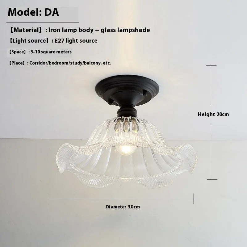 American retro style single-head ceiling or wall lamp with a glass cover.