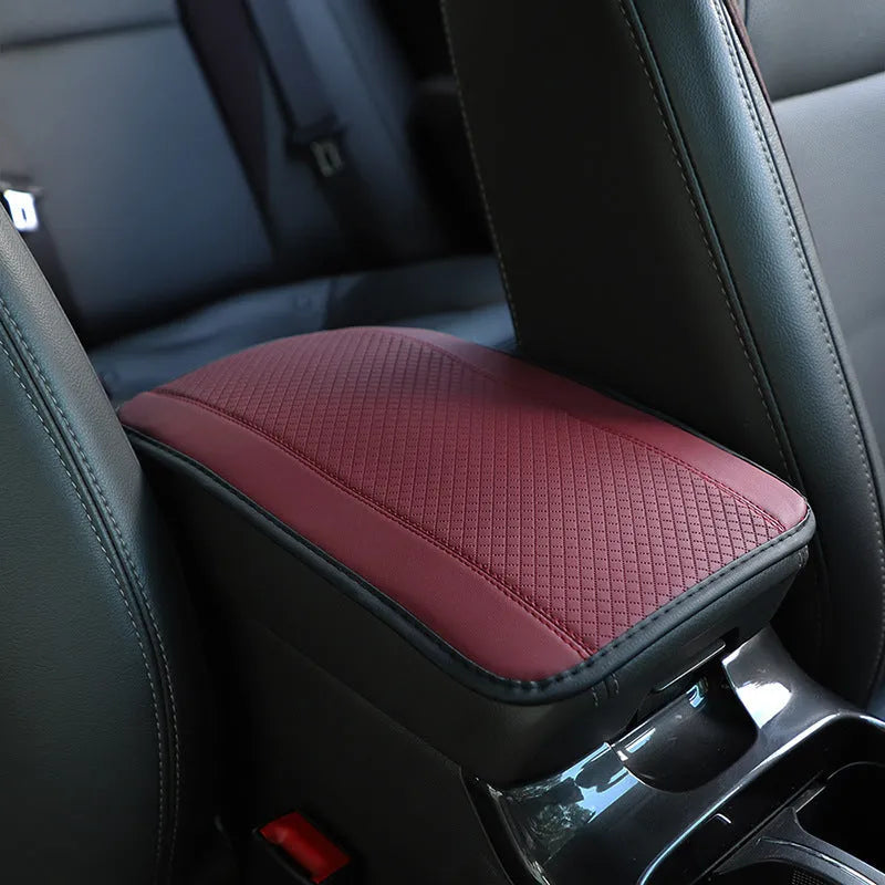 PU leather automotive armrest box cushion measuring 32x19cm in black with red cord detailing