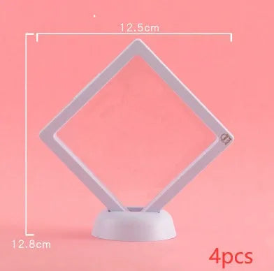 3D floating display case holding coins and jewellery between transparent membrane sheets