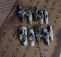 Blue plastic nail armour suit with rose and tulip patterns for evening wear.