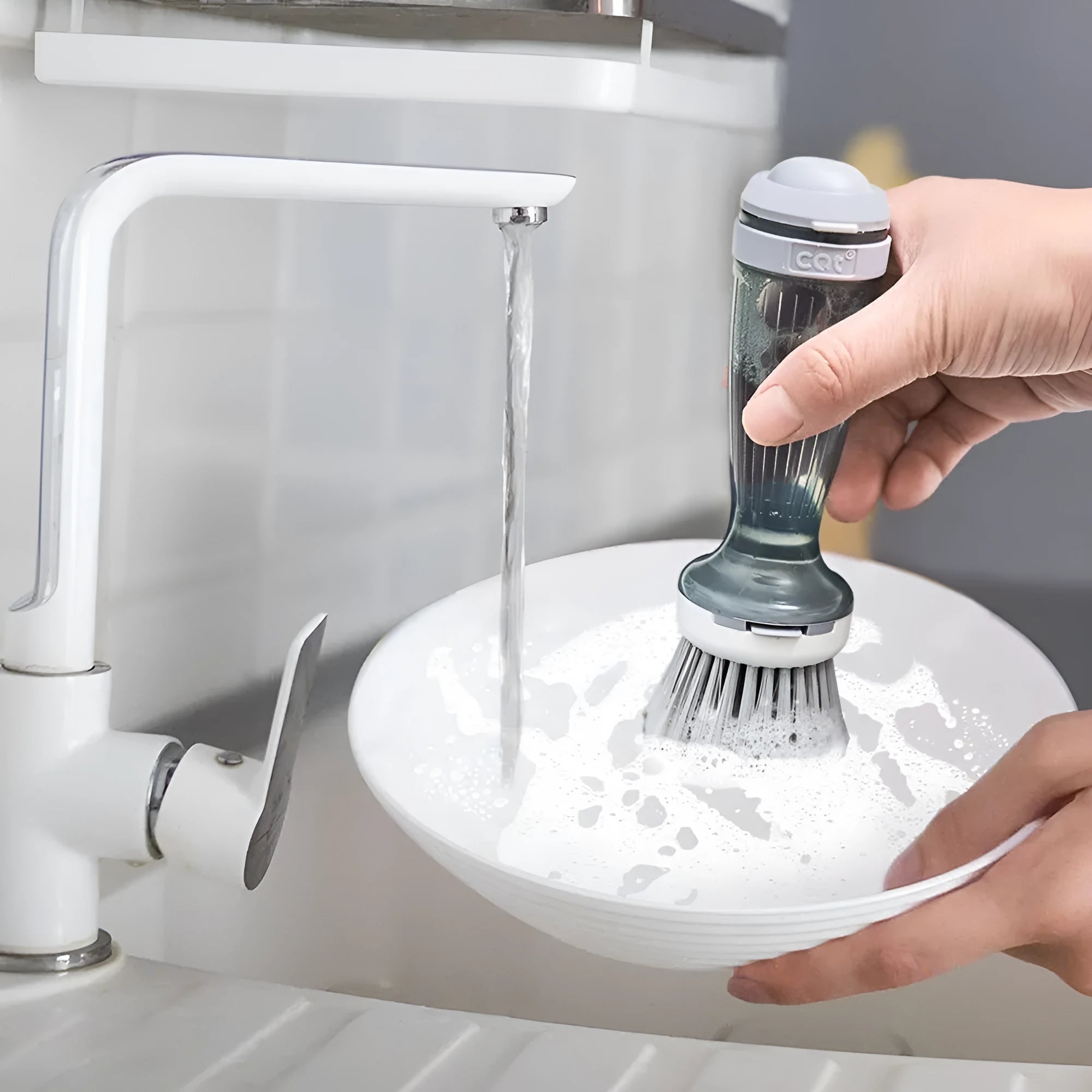 Pot and dish brush with integrated soap dispenser and replaceable brush head in mint green