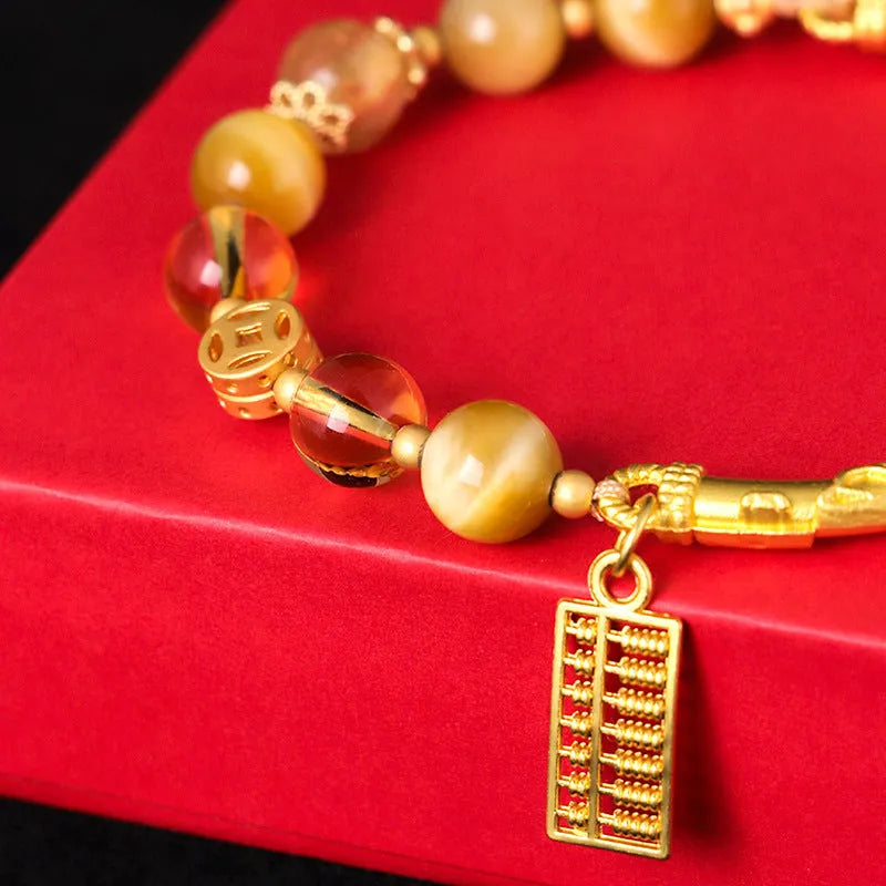 Women's abacus tag bracelet with tigereye and citrine beads and copper diamond-shaped tag