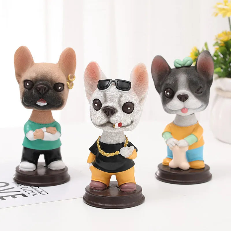 Resin dog car ornament with shaking head, 12cm, in bones style on a car dashboard