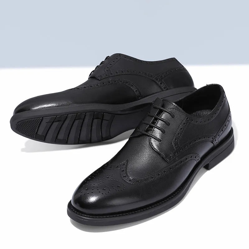 Men's black brogue leather shoes with wingtip perforations and lace-up closure on neutral background