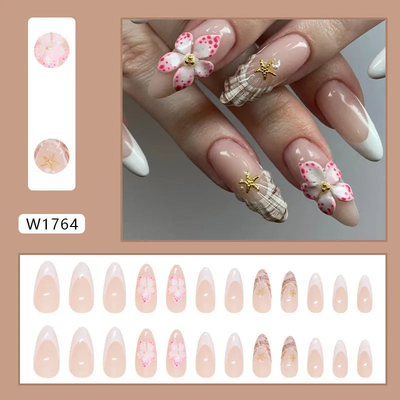 Removable fake nails with simple flower French style and rock pattern patch design in a plastic kit.