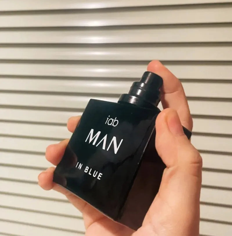 50ml glass bottle of men's citrus perfume with spray applicator