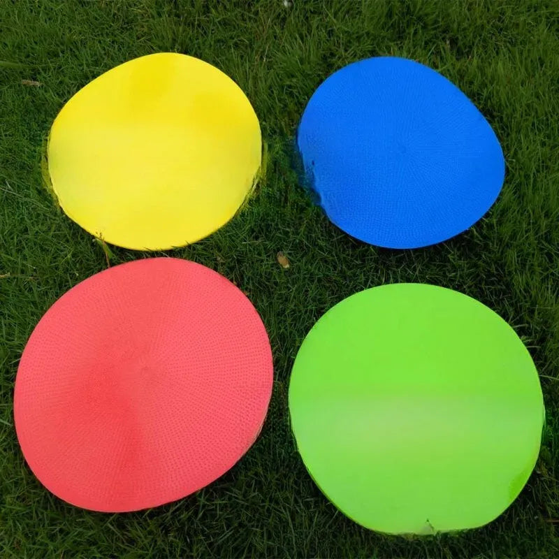 Soft circular football training target pad in bright colours measuring 23cm across