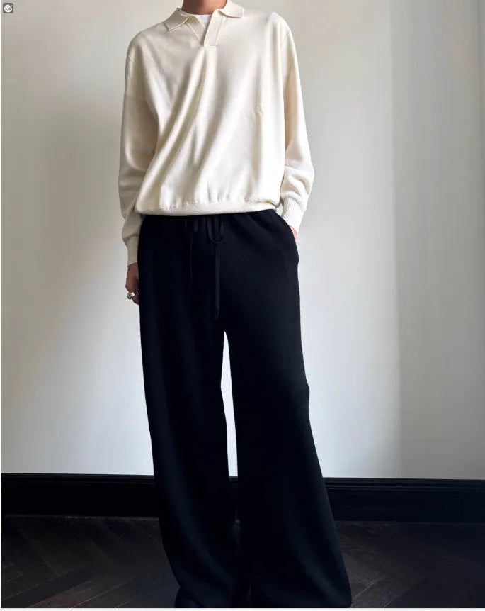 Pure wool polo sweater with a lapel collar in navy blue, shown in a loose fit on a model.