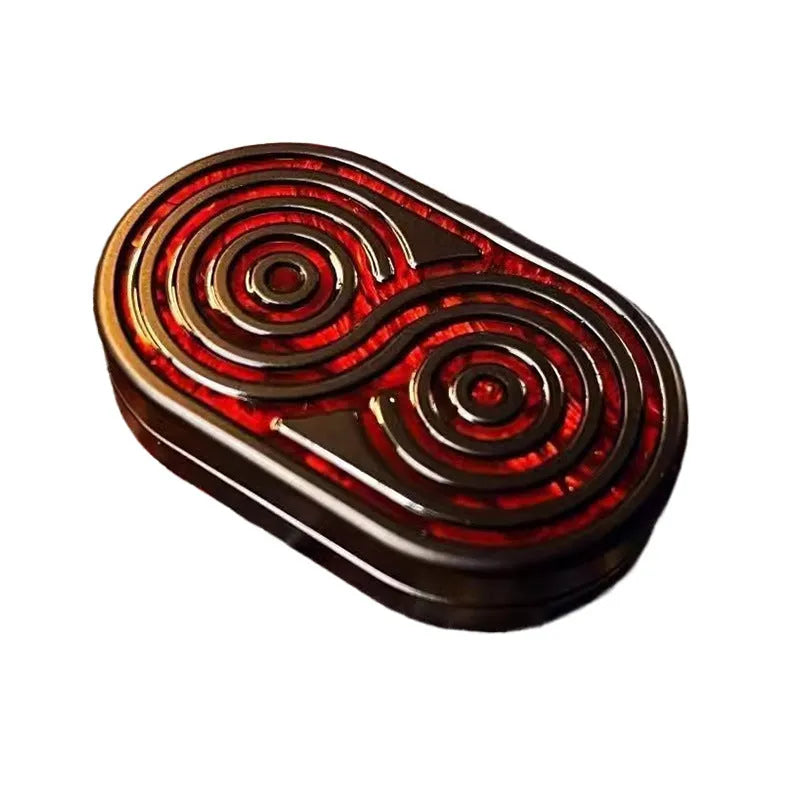 Stainless steel EDC hand push coin fidget toy in Agate Red colour on surface