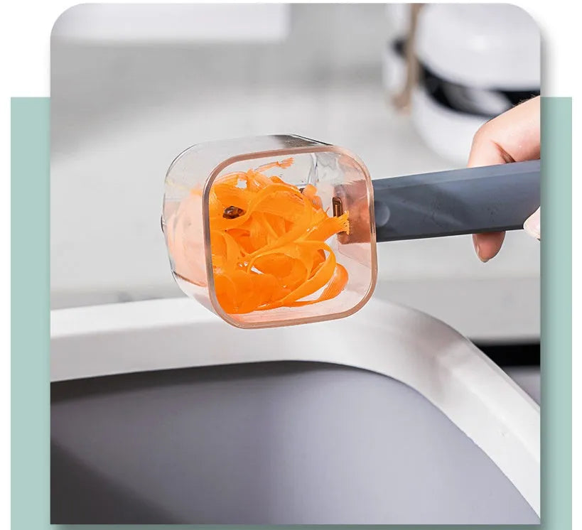 Stainless steel kitchen peeler with PP plastic handle in choice of green, grey, or red colours