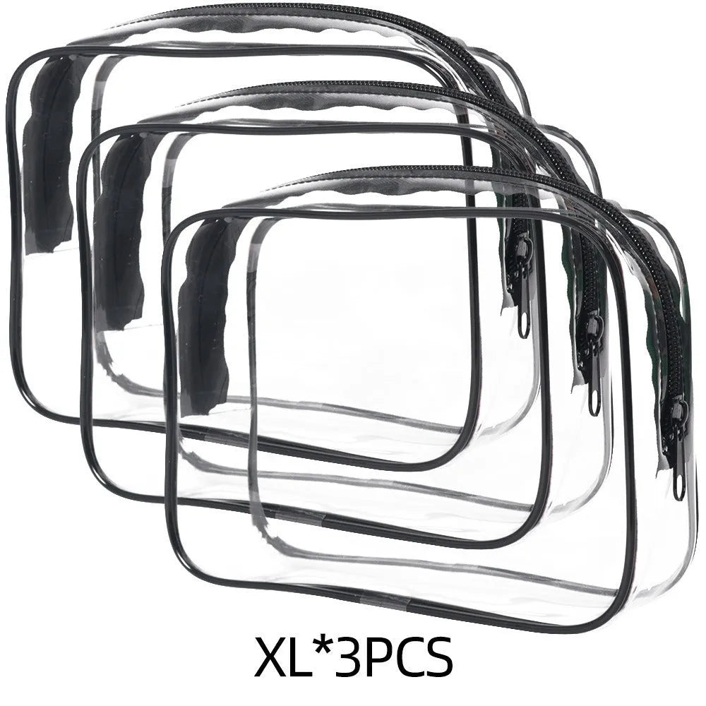 Set of three semi-transparent PVC makeup bags in black, pink, and white colours with handles