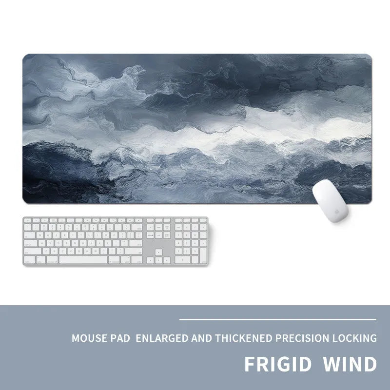 Oversized natural rubber mouse pad with printed graphic and integrated wrist support on a desk.