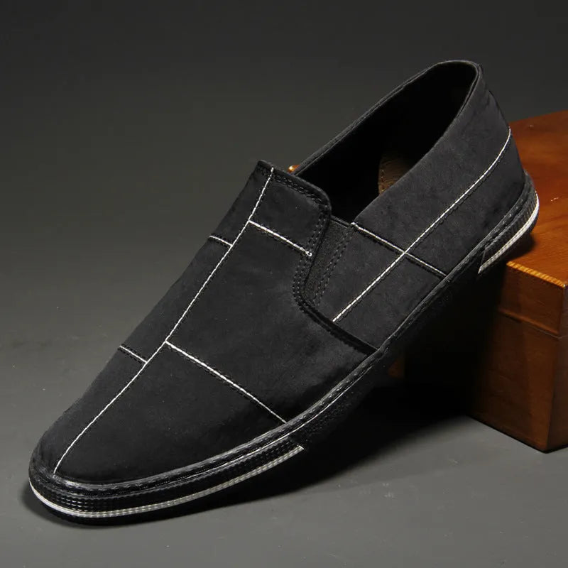 Men's low-top slip-on canvas shoes in multiple colours with round toe and flat rubber sole.