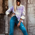 Lilac plaid print women's loose-fit long sleeve sweater with ribbed cuff and hem trim.