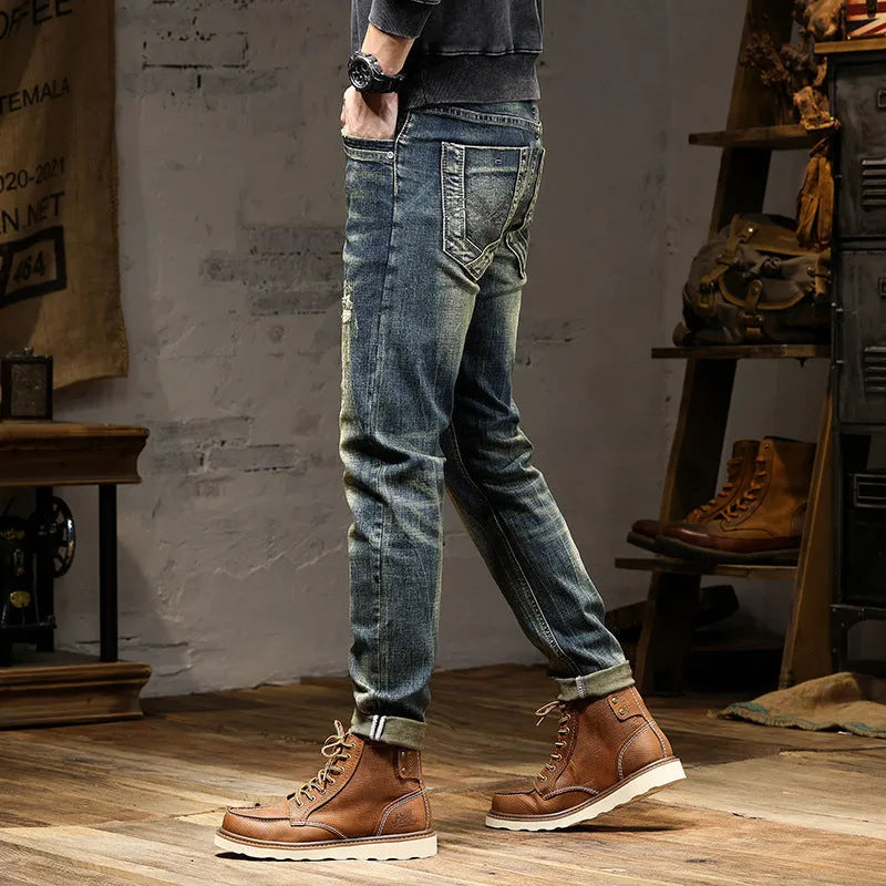 Men's skinny fit stretch jeans in a retro colour, showing zip fly and cotton denim fabric.