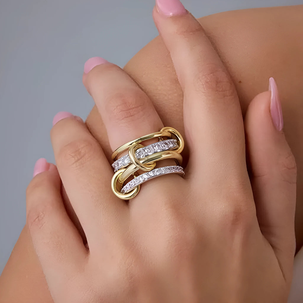 Women's handmade multi-layer silver diamond ring in copper and zirconia, side view on neutral background