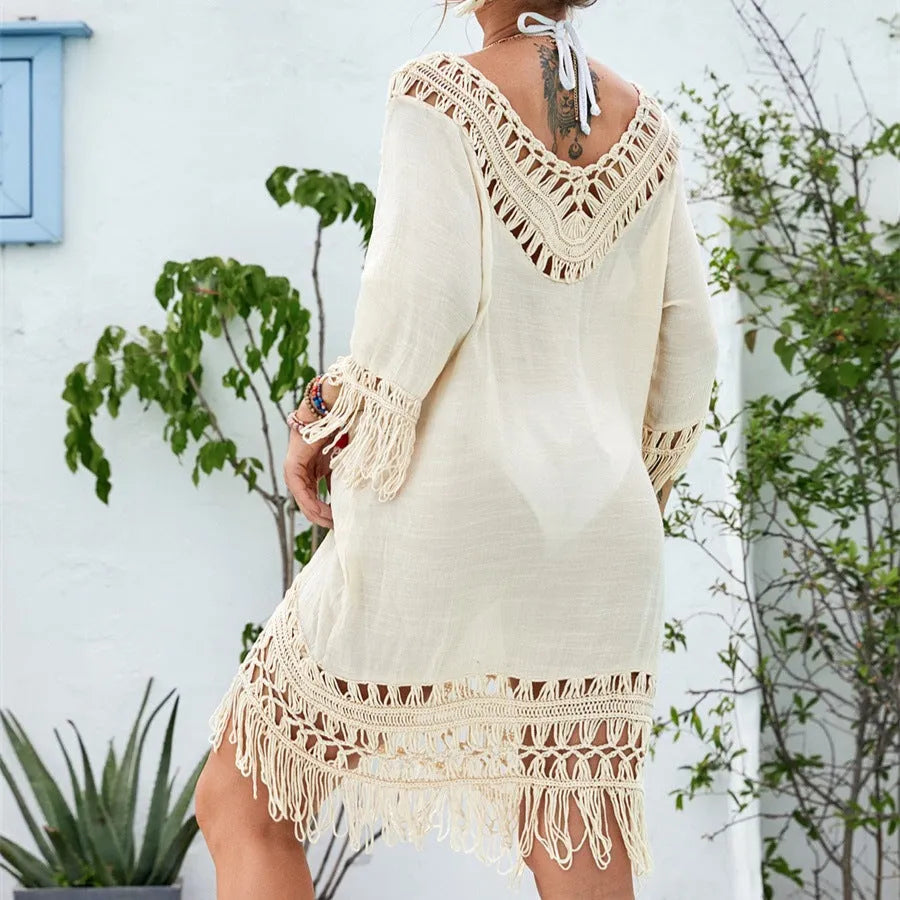 Apricot-coloured crochet patchwork beach dress with half sleeves on a model