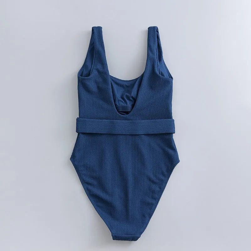 Navy blue women's one-piece swimsuit with triangle neckline and chest pads