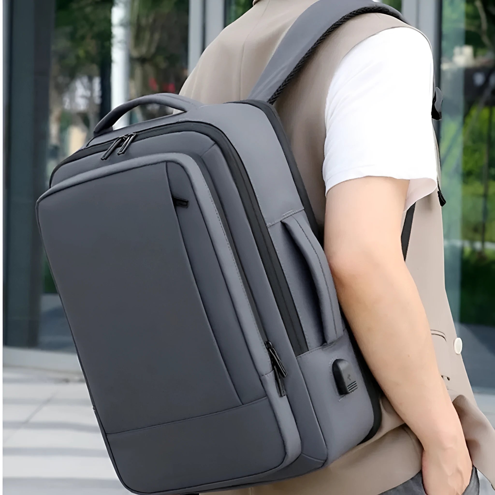 Black waterproof Oxford cloth business backpack with curved shoulder straps and derm leather detailing