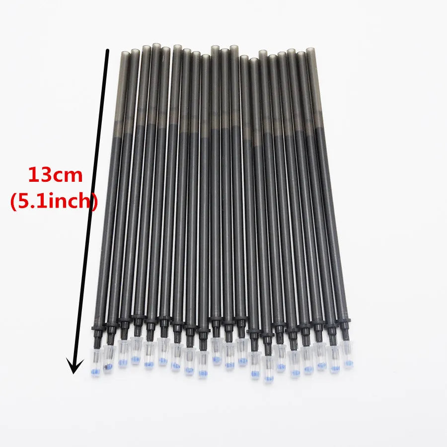 0.5mm hot erasable pen sets in black, blue, and red with refills and nibs on a desk