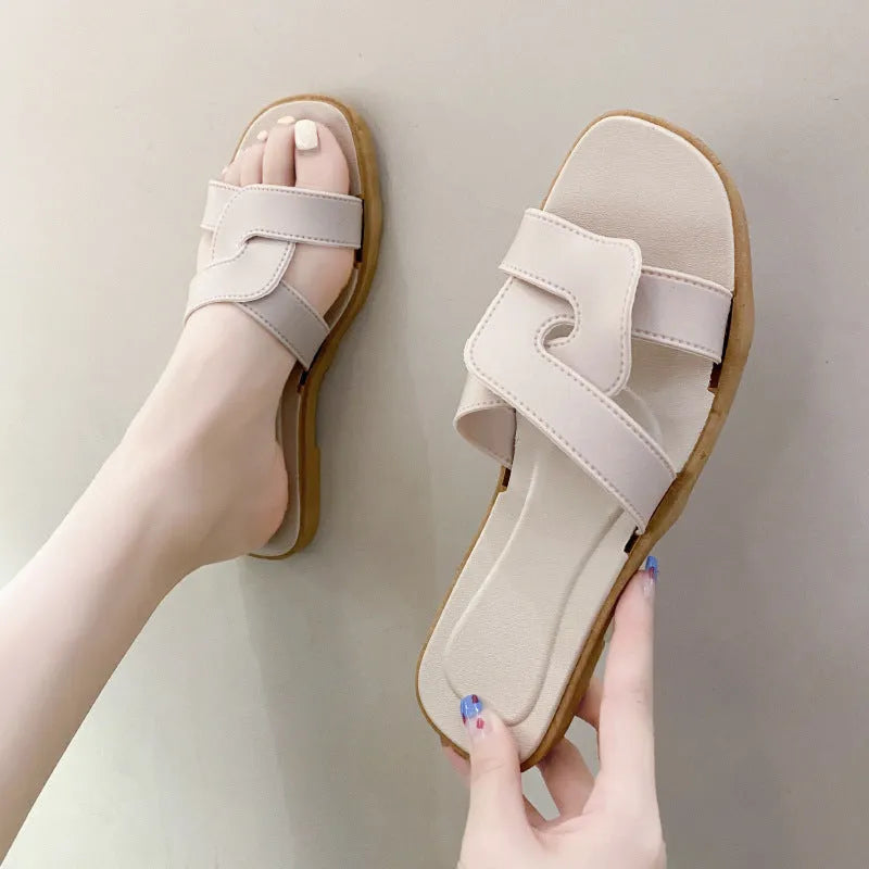 Women's PVC cross strap non-slip sandals in beige white colour on a plain background