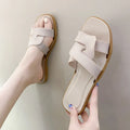 Women's PVC cross strap non-slip sandals in beige white colour on a plain background