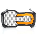 BMW motorcycle headlight protective cover in a choice of colours including fluorescent yellow, mounted on a GS adventure bike.