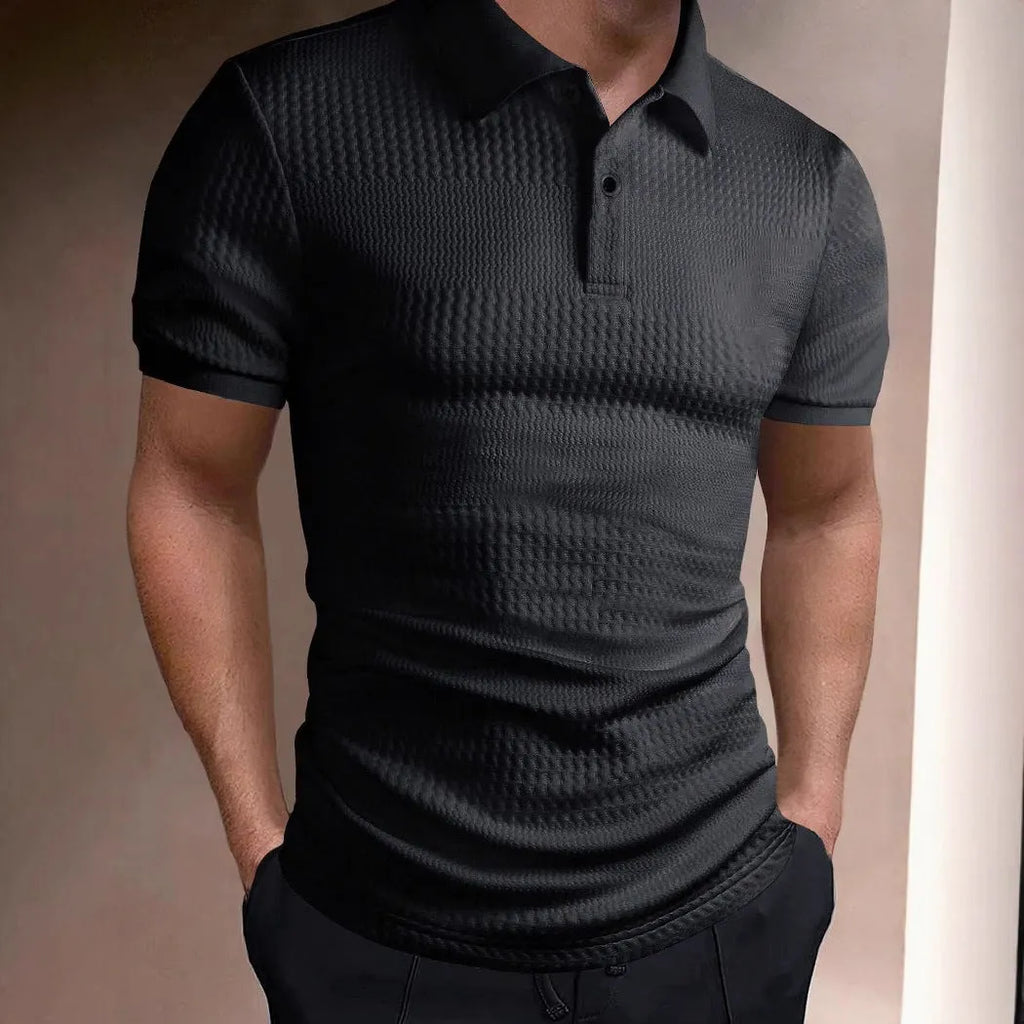 Man wearing a loose fit striped polo shirt in a light blue colour with an asymmetric design detail.