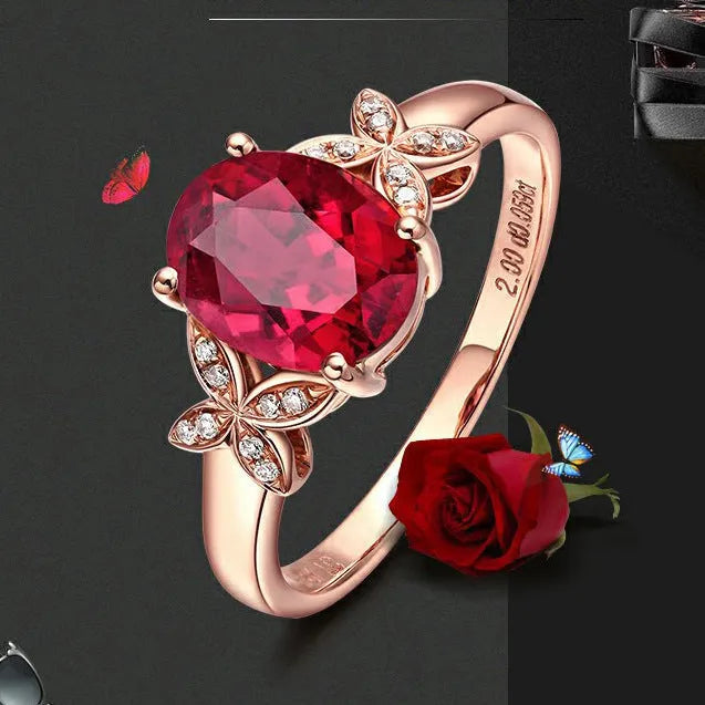 Women's butterfly ring with heart-shaped design in copper and rose gold plating, showing blue and red colour options