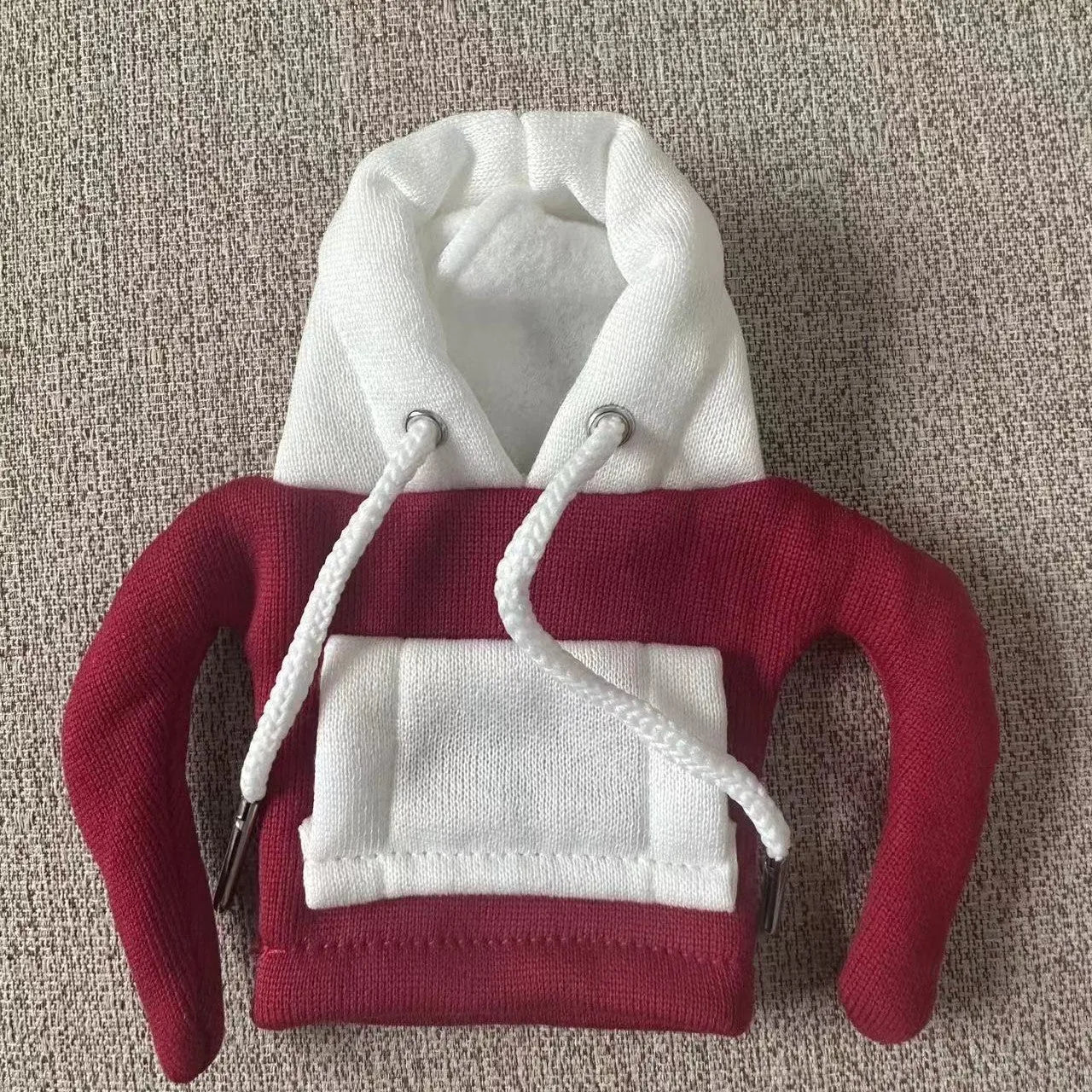 Polyester knit hood cover for car gear lever in red and white colour combination.