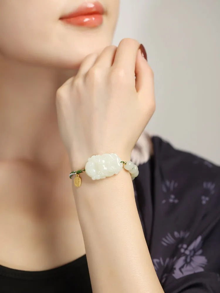 Hetian jade rabbit zodiac bracelet with S925 silver charm on red ice cotton rope