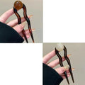 Simple retro-style U-shaped hair barrette made of acrylic in a beige colour.